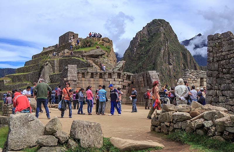 Tourists observing the main temple of Machu Picchu